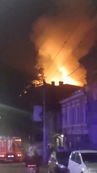 A fire burns on the roof of an apartment building, in the aftermath of a reported drone attack, according to the acting Rostov region governor Yuri Slyusar